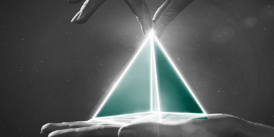 Image of a hand pinching a glowing triangle to represent - Stimulus, Stability, and Sentiment: The 2026 Playbook